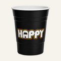 A black plastic party cup with a white interior, featuring the word 'HAPPY' printed on the front in white block letters with a red and yellow outline.