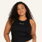 Woman wearing a black tank top with text on a white background