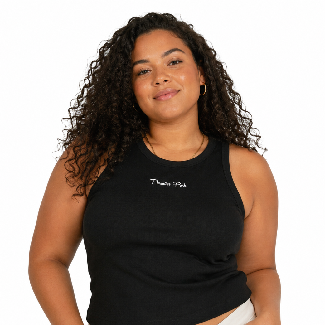 Woman wearing a black tank top with text on a white background