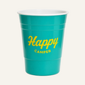 A teal plastic party cup with a white interior, featuring the words 'Happy CAMPER' printed in yellow on the front, set against a plain white background.