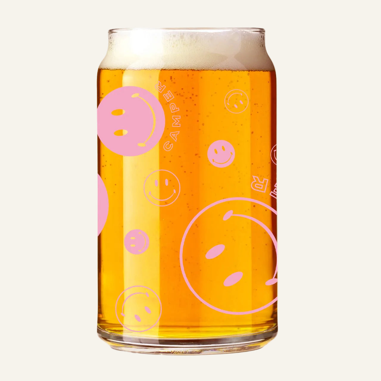 This image features a playful and creative smiley can glass. The glass is shaped like a can and is filled with a beverage, showcasing a vibrant orange color.