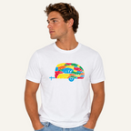 A man wearing a white crew-neck t-shirt with a colorful retro camper graphic on the chest, paired with light blue jeans, set against a plain white background.