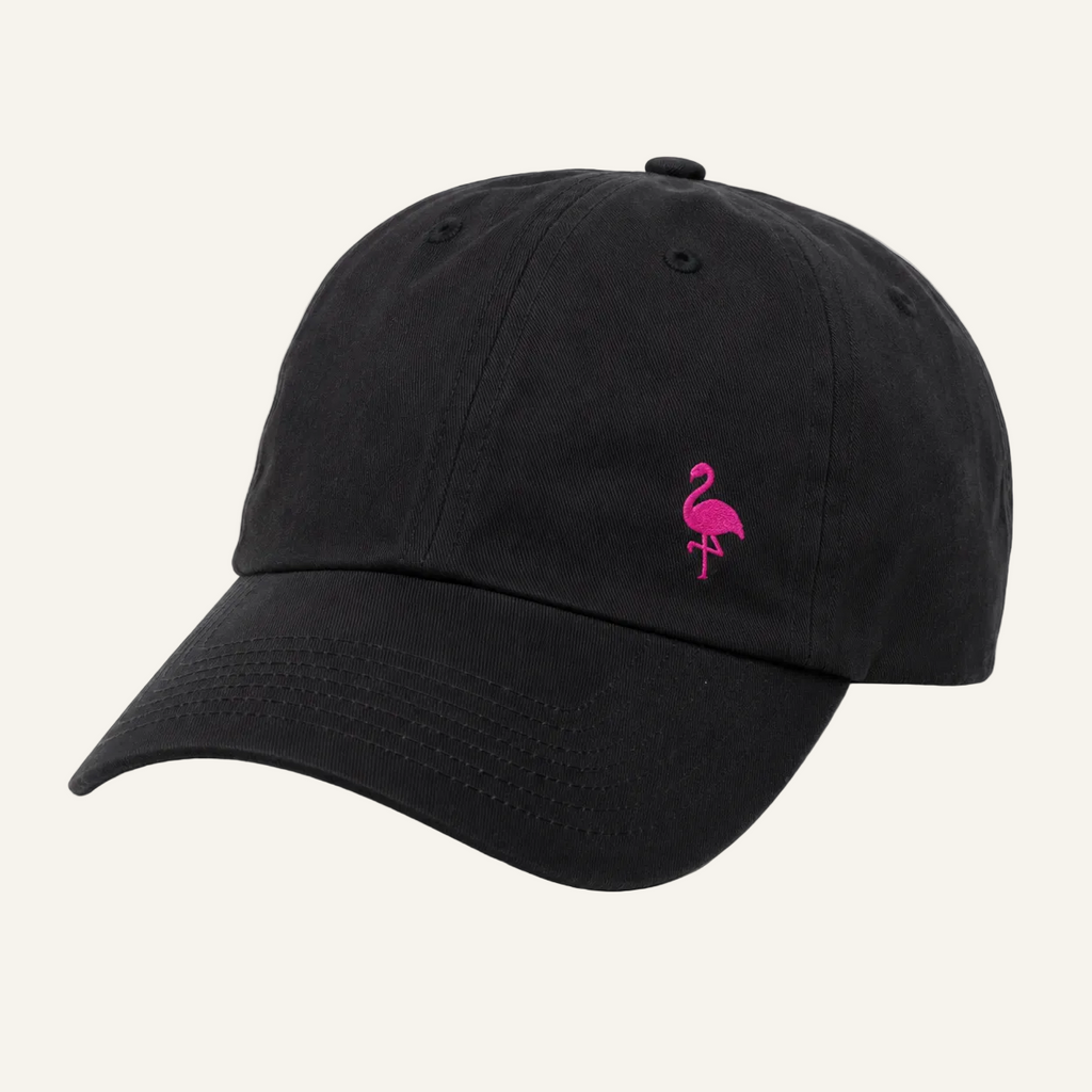 A black cotton baseball cap featuring a small embroidered pink flamingo on the front, set against a plain white background.
