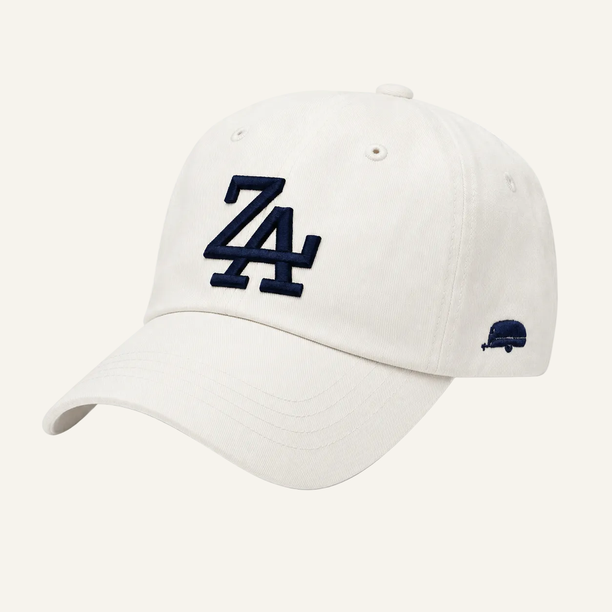 An off-white baseball cap featuring a navy blue embroidered 'ZA' logo on the front and a small navy blue side logo, set against a plain white background.